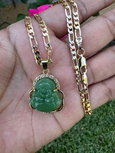 This gold-plated Buddha pendant necklace will add a touch of serenity and spirituality to your look. Showcasing a classic Buddha figure, this necklace will bring a peaceful energy to your wardrobe.Gold plated 18” Chain Buddha Pedant with Chain Tarnish free/won't turn your skin green with proper care Pendants and Chains are gold plated 5 times for a long lasting durable shine Spiritual Gold Crystal Necklace With Round Pendant, Spiritual Gold Plated Necklace For Good Luck, Gold Spiritual Crystal Necklaces With Adjustable Chain, Gold Spiritual Crystal Necklace With Adjustable Chain, Spiritual Gold Necklace With Figaro Chain, Spiritual Gold Figaro Chain Necklace, Gold Necklace With Figaro Chain, Spiritual Gold Plated Chain Necklace, Spiritual Pendant Necklace With Figaro Chain