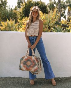 Relaxed Fit 95% Cotton and 5% Spandex Hand Wash Cold. Dry Flat Not Lined¨C Sheer Crew Neckline Scalloped Hemline Crochet Fabrication No Closures Go for a beachy cute look in the Nima Cotton Crochet Crop Top in cream that's detailed with a scalloped hemline.Styled with: Treble Necklace. Gateway Bag. and Boomerang Denim.---SIZE AND FIT---Model is Wearing a Size Medium. Height is 5'9". Bust is 34.5". Waist 28". and Hips 41" Size XS: Length measures 16" from shoulder to hem with a 32" bust Size S: L Bell Bottom Jeans Outfit Summer, Crochet Top Outfit Summer, Bell Bottom Jeans Outfit, Crochet Top Outfit, Cotton Crop Top, Crochet Crop, Crochet Crop Top, Cotton Crochet, Her Style