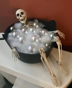 a skeleton in a bathtub filled with bubbles and soapy water for halloween decorations