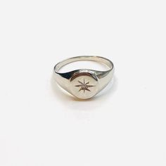 Description: Beautifully engraved starburst silver signet ring with a Cubic zirconia centre piece. Can easily be mixed with other jewellery fromOur celestial range. Material : 925 Sterling silver Comes gift wrappedMy jewellery is packaged in a sturdy gift box that protects it and makes it easily to store. Online store : www.raw-london.co.ukInstagram: @rawlondonjewelleryEmail me: sales@raw-london.co.ukDo not hesitate to contact me with any doubts, I am happy to help you!Metal: Silver Condition: N Silver Star-shaped Diamond Ring Gift, Silver Oval Initial Ring Tarnish Resistant, Star-shaped Signet Ring For Promise - Fine Jewelry, Star Shaped Fine Jewelry Signet Ring For Promise, Silver Minimalist Signet Ring For Promise, Minimalist Silver Signet Ring For Promise, Sterling Silver Promise Signet Ring, Silver Sterling Signet Ring For Promise, Silver Sterling Silver Signet Ring For Promise