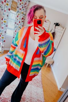 Introducing your new spring staple: the In Love Rainbow Crochet Striped Spring Cardigan! With a vibrant rainbow design and open weave crochet pattern, this cardigan is sure to add some fun to any outfit. Perfect for a sunny day or a chilly evening, this cardigan is a must-have for any fashion-forward individual. 100% Acrylic Soft Light Layer Open Cardigan Relaxed Fit :: Approximate Measurements :: ** Approx measurements listed below are of the actual clothing item laid flat ** • Top stretches an Colorful Knit Spring Cardigan, Colorful Knitted Spring Cardigan, Colorful Knit Cardigan For Spring, Trendy Colorful Spring Cardigan, Rainbow Knit Sweater For Spring, Spring Multicolor Knitted Cardigan, Red Crochet Cardigan For Spring, Multicolor Open Knit Cardigan, Casual Multicolor Open Knit Cardigan