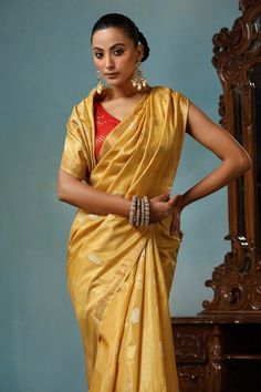 Light yellow gold handwoven saree crafted in kosa silk featuring flower and leaf motif. Comes with a running blouse piece. - Aza Fashions Gold Chanderi Blouse For Transitional Seasons, Transitional Gold Chanderi Blouse, Gold Pre-draped Saree With Cutdana For Navratri, Gold Raw Silk Traditional Wear For Navratri, Bollywood Style Gold Pre-draped Saree With Pallu, Traditional Gold Pre-draped Saree For Navratri, Gold Pre-draped Saree With Cutdana In Traditional Drape, Gold Dupatta Blouse For Festive Occasions, Festive Gold Blouse With Dupatta