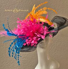 Looks elegant and beautiful from all angles. Absolute color frenzy that will bring energy and movement to your ensemble. Pretty feather bursts are seated on layers of sinamay. (Various color combinations available; please inquire). Customization is available; please inquire to see if we can meet your needs.   Perfect for Kentucky Derby, Del Mar Races, Melbourne Cup, Royal Ascot, Breeders' Cup, Hat Contests, Church, Gala, Derby, Cocktail, High Tea, Weddings, Preakness, and more.   *FREE SHIPPING  Though often copied by hobbyists and even high-end department stores, discriminating fashionistas from all walks of life count on Aimee's pieces to lead the trends and make one-of-a-kind statements in their ensembles, fashion shoots, and style shows. You can also see her designs on everyone from ju Multicolor Carnival Hats For Summer, Multicolor Summer Carnival Hat, Multicolor Brimmed Hat For Kentucky Derby, Multicolor Hats For Kentucky Derby Evening, Multicolor Mini Hats For Royal Ascot, Multicolor Costume Hats For Royal Ascot Races, Multicolor Costume Hats And Headpieces For Royal Ascot, Multicolor Mini Hats With Curved Brim For Party, Multicolor Curved Brim Mini Hat For Party