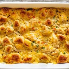 a casserole dish filled with chicken and cheese