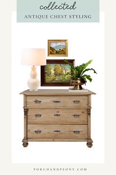 an antique chest with a painting and lamp on top