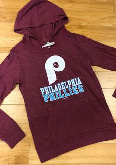 Philadelphia Phillies Womens Maroon Tri-Blend Draw String Hooded Sweatshirt Fan Merchandise Drawstring Hood Top, Hooded Tops For Fan Merchandise, Sporty Tops With Drawstring Hood For Fan Merchandise, Fan Gear Hooded Top With Letter Print, Fan Apparel Hooded Top With Logo Print, Hooded Fan Apparel Top With Logo Print, Sports Event Fan Apparel Tops With Drawstring Hood, Fan Apparel Tops With Drawstring Hood For Sports Events, Fan Merchandise Hooded Top With Drawstring Hood