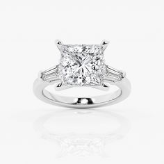 a princess cut diamond ring with three baguets on the shoulders and side stones