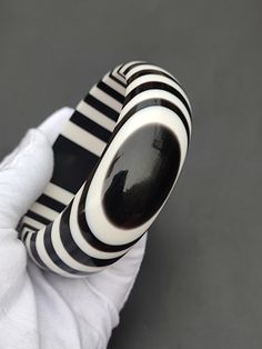 you will receive 1 Piece of MOD Black & White Resin Smooth Bangle Bracelet Vintage Chunky Bangle Statement Purely Handcrafted Bohemian Lucite Bangle Fashion Jewelry. Inner Diameter Size: 2.6" Approx. Width Size: 1" Approx. Thank you very much for visiting! Any questions, please feel free to contact us. Discount for bulk provide. Black Bohemian Bracelet, Bohemian Black Bangle As Gift, Handmade Black Bohemian Bangle, Handmade Adjustable Black Bangle, Adjustable Black Handmade Bangle, Unique Black Bangle Cuff Bracelet, Unique Black Adjustable Bangle, Adjustable Handmade Black Bangle, Unique Adjustable Black Bangle