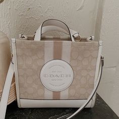 Coach Tote Bag In Great Used Condition Has Some Minor Wear On The Bottom ( Second Picture) But Can Be Cleaned Detachable Strap Measurements: Length: 8.75" Height: 6.25" Width: 4.25" Coach Dempsey Tote, Coach Tote Bag, Luxury Bags Collection, Handbag Essentials, Coach Tote Bags, Girly Bags, Coach Tote, Fancy Bags, Bags Coach