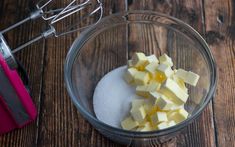 there are many cubes of butter in the bowl next to a whisk