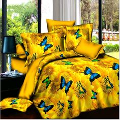 a bed with sunflowers and butterflies on it