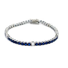 Introducing our stunning Silver Tennis Bracelet, meticulously crafted in Italy and plated with radiant rhodium. This bracelet is a true symbol of elegance and sophistication, blending classic design with modern flair. Each link of the bracelet features mesmerizing blue round-cut stones alternating with dazzling white princess-cut stones. The harmonious combination of these exquisite gems creates a striking contrast that captivates the eye and adds a touch of luxury to any ensemble. Crafted with Luxury Blue Tennis Bracelet For Wedding, Elegant Blue Bracelet With Brilliant Cut, Timeless Polished Tennis Bracelet For Formal Occasions, Modern Brilliant Cut Tennis Bracelet As Gift, Modern Tennis Bracelet With Brilliant Cut For Gift, Modern Brilliant Cut Tennis Bracelet, Modern Round Cut Tennis Bracelet As Gift, Classic Blue Sterling Silver Tennis Bracelet, Classic Bracelets With Diamond Cut Cubic Zirconia