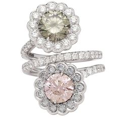 The 18k white gold flower bypass ring features a GIA 1.93-carat fancy dark greenish-gray round brilliant-cut diamond and a GIA 1.70-carat fancy brown-pink round brilliant-cut diamond. Each stone is surrounded by blue-gray and near colorless round brilliant-cut diamonds, weighing in total 2.69 carats. The ring is a size 6 1/4, and weighs 7.71 grams. Accompanied by GIA reports #1132613962 and #5121274309. A unique and beautiful statement ring. Pink Sapphire Jewelry, Pink Diamond Jewelry, Jewellery Rings, Vintage Style Rings, Bypass Ring, Jewelry Rings Diamond, Bling Rings, Diamond Flower, Diamond Gold