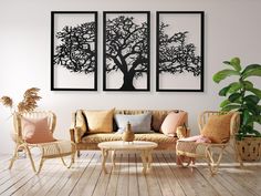 a living room filled with furniture and paintings on the wall above it's wooden flooring