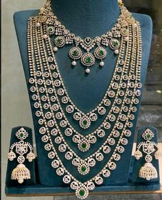 an elaborate necklace and earring set on display