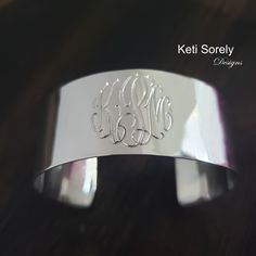 "Large cuff bracelet with etched monogram initials in the precious metal of your choice. Create personalized gift for your loved ones. Amazing jewelry for every day wear or special occasions. Designs by: Keti Sorely. Metal options: *Brass w/ yellow gold overlay *Brass w/ Rose gold overlay * Sterling Silver  * Sterling Silver with yellow gold overlay * Sterling Silver with Rose gold overlay Bangle width - 1\" Choose bangle sizes: Small (6-6.5\"),  Medium (7-7.5\")  Large (8-8.5\"). 1 to 3 letters Elegant Stamped Cuff Bracelet Bangle, Elegant Engraved Cuff Bracelet For Anniversary, Luxury Engraved Cuff Bracelet For Anniversary, Elegant Stamped Cuff Bracelet In Bangle Style, Personalized Silver Bracelet With Initials, Personalized Silver Bracelets With Initials, Engraved Cuff Bracelet For Wedding, Elegant Hand Stamped Silver Name Bracelet, White Gold Cuff Jewelry For Anniversary