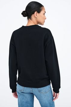 Minimalism with a twist—literally. From breathable, midweight European French Terry, our Rutland Sweatshirt is a relaxed fit pullover distinguished by a knot detail at the hem. Featuring dropped shoulders and long sleeves, she also offers ribbed texture around her neckline and cuffs for quintessential athleisure chic - to keep you both cozy and stylish for days and nights.[SPLIT] Astrid, in black, is 5'9" (175 cm) tall, wearing size XS. Yada, in off white, is 5'9" (175 cm) tall, wearing size XS. Oversized Sweatshirt For Workwear, Fall Solid Tops With Ribbed Waistband, Solid Tops With Ribbed Waistband For Fall, Oversized Casual Sweatshirt For Workwear, Sporty Fall Tops For Work, Athleisure Chic, Tunic Hoodie, Ribbed Texture, Long Sleeve Sweatshirts