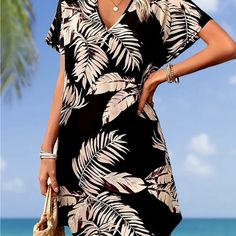 Batwing Dress Tropical Vibes Black Floral Print Dresses For Beach Season, Chic Black Mini Dress For Beach Season, Knee-length Black Mini Dress For Vacation, Black Knee-length Mini Dress For Vacation, Black Knee-length Beach Dress, Black V-neck Mini Dress For Beach Season, Black Knee-length Dress For The Beach, Brown Knee-length Mini Dress For Beach, Brown Knee-length Mini Dress For The Beach