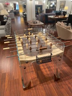 a foosball table in the middle of a living room