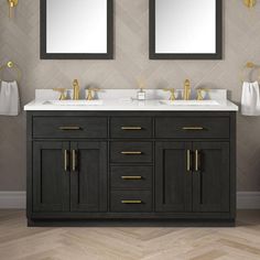 two mirrors are above the double sink vanity in this modern bathroom with herringbone wallpaper