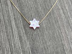 This beautiful Star of David /Magen David/Jewish Star Opal Necklace is sure to be someone's favorite. It's a great Bat Mitzvah or Hanukkah gift. Sterling Silver or 14kt Gold Filled Charm Size: 10mm Lab Created Opal Your Choice of Length and Color Chain Styles: 0.7mm Box Chain Disclaimer: Before placing an order for a necklace or bracelet, please ensure you measure your desired size carefully. Customers are fully responsible for choosing the correct length, as all cut chains are non-refundable. I 14k Gold Star Of David Jewelry Gift, 14k Gold Star Of David Necklace Gift, Star Of David Charm Jewelry Gift, Gift 14k Gold Star Of David Necklace, Star Of David Necklace For Gift, Star Of David Necklace For Hanukkah Gift, Hanukkah Gift Necklace With Star Of David, Spiritual Jewelry For Hanukkah Gift, Judaica Jewelry