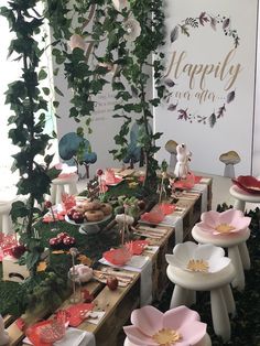 an image of a table set up with flowers and plants for a wedding or baby shower