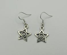 Silver Swirl Spiral Drop Dangle Earrings Star Earrings Swirl Star Earrings y2K Earrings indie gothic whimsigoth Star Jewelry Silver Star Gothic Earrings, Gothic Silver Star Earrings, Gothic Star-shaped Pierced Earrings, Whimsigoth Earrings, Whimsigoth Jewelry, Swirl Star, Earrings Y2k, Y2k Earrings, Spiral Jewelry