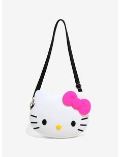 a hello kitty purse with a pink bow on the front and black strap around it