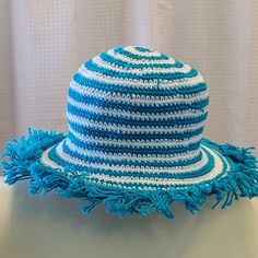 Our hats provide optimal coverage for a day at the beach or the pool. Try this fun look with silly fringe and stripes... a fun new twist on our most popular item! Variety of colors available. Hand crocheted, 100% cotton, washable Fringe Hat, Crochet Fringe, A Day At The Beach, Day At The Beach, Sarong, The Pool, Hand Crochet, At The Beach, Most Popular