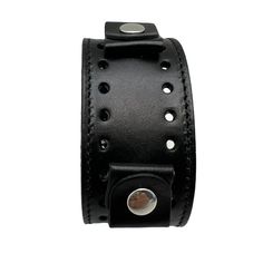 Item: BK-k Cuff Style: Junior Cuff Type: Buckle Cuff Material: Patent Leather Band Cuff Length (With Buckle): 9.5" Band Cuff Width: 1.5” Band Cuff Holds: 20-22 Millimeters Watch Cuff Color: Black Punk Style Leather Cuff Bracelet With Wrist Strap, Punk Leather Cuff Wristband, Black Punk Cuff Jewelry, Adjustable Black Punk Cuff Bracelet, Adjustable Classic Cuff Bracelet, Adjustable Black Cuff Bracelet Punk Style, Adjustable Black Band Punk Cuff Bracelet, Adjustable Punk Cuff Bracelet With Black Band, Black Band Leather Bracelet