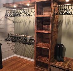 a wooden shelf filled with shoes next to a wall mounted coat rack and shoe rack