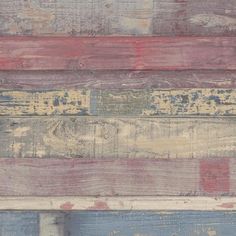 multicolored wooden planks with peeling paint and chipping on the bottom half