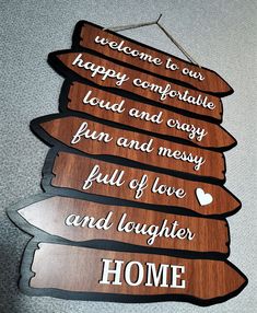 a wooden sign that says welcome to you happy comfortable and easy fun and messy full of love and laughter