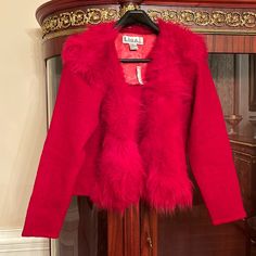 Lisa International 100% Boiled Wool Faux Fur Trimmed Long Sleeve Red Jacket. Brand New, Never Worn. But Was Stored In The Closet For Some Time And Has Some Little Dots Of Worn Wool On The Sleeves Area. I Have Them In Closed In The Pictures. Red Fur Coat With Faux Fur Trim For Fall, Red Faux Fur Coat For Fall, Red Winter Fur Coat With Faux Fur Trim, Red Fur Coat With Faux Fur Trim For Winter, Winter Red Fur Coat With Faux Fur Trim, Fitted Red Outerwear For Cold Weather, Red Fur Coat For Fall, Red Faux Fur Outerwear For Fall, Red Fitted Outerwear With Faux Fur Trim