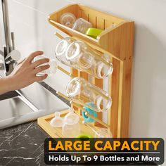 NEAT AND ORGANIZED: Achieve a tidy and organized look for your baby bottles with the help of our bamboo baby bottle drying rack. VERSATILE STORAGE: Our bottle organizer is specifically designed to accommodate various baby bottle sizes and assist in kitchen storage organization. DIMENSIONS: The baby bottle drying rack measures 10.6 inches in length, 6.3 inches in width, and 14.5 inches in height. EFFICIENT BOTTLE STORAGE: Our bottle drying rack is thoughtfully designed to hold baby bottles, lids, sippy cups, and even pacifiers. It optimizes kitchen counter space by accommodating more baby bottles while occupying less surface area. It can hold up to 9 bottles. SPACE-SAVING DESIGN: This compact baby bottle drying rack reclaims valuable counter space while providing ample room to dry multiple Baby Bottle Storage For Small Kitchens, Baby Bottle Drying Rack, Baby Bottle Storage, Bottle Drying Rack, Bottle Organizer, Small Kitchen Storage, Sippy Cups, Bottle Storage, Baby Bottle