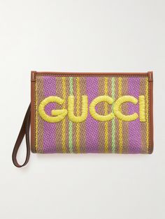 Gucci's pouch has a handy wristlet strap for easy carrying. It's been made in Italy from colorful, striped raffia embroidered with the logo in bold yellow letters across the front and is reinforced with smooth leather trims. The canvas-lined interior will comfortably stow your phone, cardholder and keys. Gucci Rectangular Bag With Embroidered Logo, Gucci Designer Bag With Embroidered Logo, Designer Gucci Bag With Embroidered Logo, Gucci Multicolor Bags For Daily Use, Daily Use Multicolor Gucci Bags, Leather Letters, Gucci Pouch, Yellow Letters, Gucci Leather