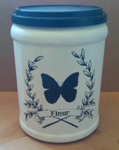 a blue and white jar with a butterfly on it