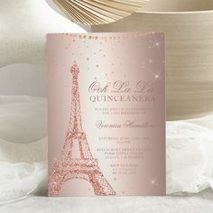 a pink and gold wedding card with the eiffel tower in paris on it