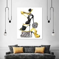 a living room with a couch and two high heeled shoes on the wall above it