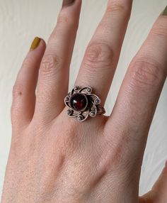 Vintage Sterling Silver Sun Flower Statement Ring. Has a purple/reddish colour stone. So stunning and such a special piece. Would make a good gift. Really pretty and unique  UK Size - N  Condition is as seen Antique Rings Victorian Silver, Red Flower-shaped Gemstone Jewelry, Red Flower Shaped Gemstone Jewelry, Victorian Garnet Ring Gift, Vintage Flower Ring With Gemstone, Vintage Flower Shaped Gemstone Ring, Vintage Flower Gemstone Jewelry, Flower Shaped Ruby Ring As A Gift, Vintage Flower-shaped Gemstone Jewelry