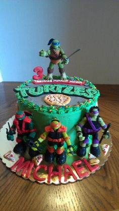 a teenage mutant ninja birthday cake with the number 3 on it and all of the figures