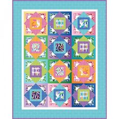 a colorful quilt with many different designs on the front and back, along with an applique