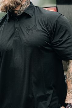 Classy yet nasty. When you need to look professional but still want to wear cool shit. • 100% polyester polo shirt• 2-piece reinforced collar• Back modern yoke• Hemmed sleeves and bottom• Side vents• Modern fit -Embroidered black logo 2.5 x 2 inches -Pictured wearing XL at 5 foot 11 / 215 lbs Black Camo, Jogger Shorts, Top Graphic Tees, Zip Up Hoodies, Axes, Black Logo, Zip Sweatshirt, Neck Shirt, Modern Fit