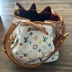 Louis Vuitton Multicolor Petite Noe Bucket Bag Blanc. Good Condition. The Vachetta Leather Is A Beautiful, Golden Patina. Measurements: 9” (L) X 7” (W) X 11” (H) Shoulder Strap Length: 28.7-32.2” Adjustable Gold Tone Hardware. Luggage Tag. 2 Pockets On Both Sides Of Bag. Louis Vuitton Multicolor, Bags Louis Vuitton, Luggage Tag, Luggage Tags, Louis Vuitton Monogram, Louis Vuitton Bag, Bucket Bag, Patina, Shoulder Strap