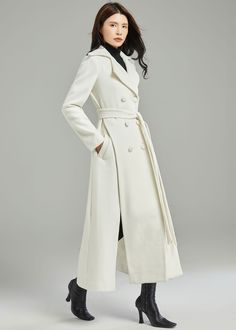 "★★ FEATURES 50% wool blend, 50% fiber, nylon Polyester lining Two side pockets Notched collar Long sleeve coat Double breasted wool coat Asymmetrical wool coat A-Line wool coat Belted wool coat Perfect for winter, autumn Dry clean * Size XS-Sample is ready to ship, Only 1 available, don't accept refund, exchange ★★Mode size Height 170cm (5′ 7″) Bust 84 cm (33\") Waist 66 cm (26\") She wears size XS. ★★ Custom order selection, Will charge 20USD-70USD custom fees Request Chang the Length Request White Wool Coat For Winter, Winter White Long Wool Coat For Fall, Cream Notch Lapel Outerwear For Winter, Winter White Pea Coat For Work, Spring Long Wool Coat, Spring Long Wool Pea Coat, Winter White Wool Coat For Work, Cream Wool Coat With Notch Lapel For Fall, Fitted Winter White Wool Outerwear