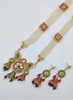 Gifting: This Indian long necklace set comes in a beautiful Tarinika gift box, making it an ideal gift for birthday, wedding anniversary or wedding gift. Care: It is advisable that you keep Tarinika products away from direct heat, humidity, and moisture. It is best to preserve your Tarinika jewelry in the box. Traditional Jewelry Gift Set With Matching Earrings, Temple Jewelry Necklaces As Gift With Elegant Design, Temple Jewelry Necklace As Gift With Elegant Design, White Jewelry Sets With Latkans, Elegant Temple Jewelry Necklaces As Gift, Bollywood Style Kundan Necklace With Intricate Design For Gift, Kundan Temple Jewelry Gift, Temple Jewelry Meenakari Gift, Traditional Necklace With Matching Earrings For Festivals