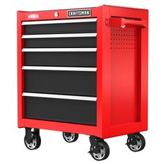 the craftsman's tool cabinet is red with black drawers and casteors on wheels