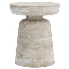 a white table with a round shaped top