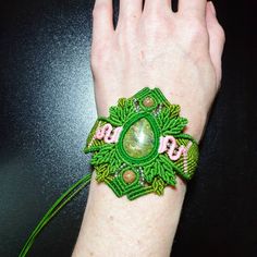 Introducing this beautiful Unakite Stone Macrame Cuff Bracelet, a stunning piece of handmade jewelry that embodies the essence of boho hippie style. Crafted with care, this bracelet showcases vibrant green and soft pink colors, perfectly complementing the natural beauty of the Unakite stone.  The centerpiece of this bracelet features an exquisite Unakite stone, characterized by its green hue with scattered pink spots, creating a unique and captivating pattern. The vibrant green and soft pink colors are thoughtfully incorporated into the macrame design, enhancing the bracelet's overall aesthetic appeal. Handcrafted with attention to detail, this cuff bracelet showcases an intricate macrame technique that adds depth and texture to the design. The adjustable cuff allows for a comfortable and Cat Macrame, Stone Macrame, Hippie Designs, Boho Hippie Style, Cuff Bracelets Handmade, Soft Pink Color, Macrame Design, Hippie Jewelry, Micro Macrame