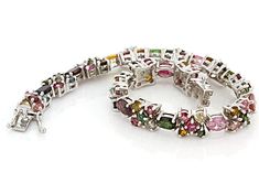 8.45ctw, 6x4mm oval and 5.33ctw, 3mm round multi-tourmaline rhodium over  sterling silver bracelet. Measures approximately 1/4"W. Box clasp with double safety.  Color mix may vary. Elegant Multicolor Gemstone Sterling Silver Bracelet, Silver Tourmaline Gemstones For Fine Jewelry, Elegant Silver Tourmaline Gemstones, Bohemian Multi-stone Sterling Silver Bracelets, Luxury Multicolor Multi-stone Sterling Silver Bracelet, Bohemian Sterling Silver Multi-stone Bracelets, Luxury Antique Multi-stone Bracelets, Broken Chain, Pearl Strands